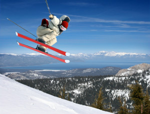 A young man jumping high at Lake Tahoe resort